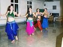 The bellydancers of Mirage perform for dorm residents.